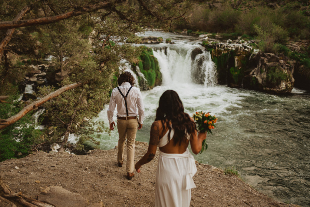 Bride and Groom walking towards Steelhead Falls