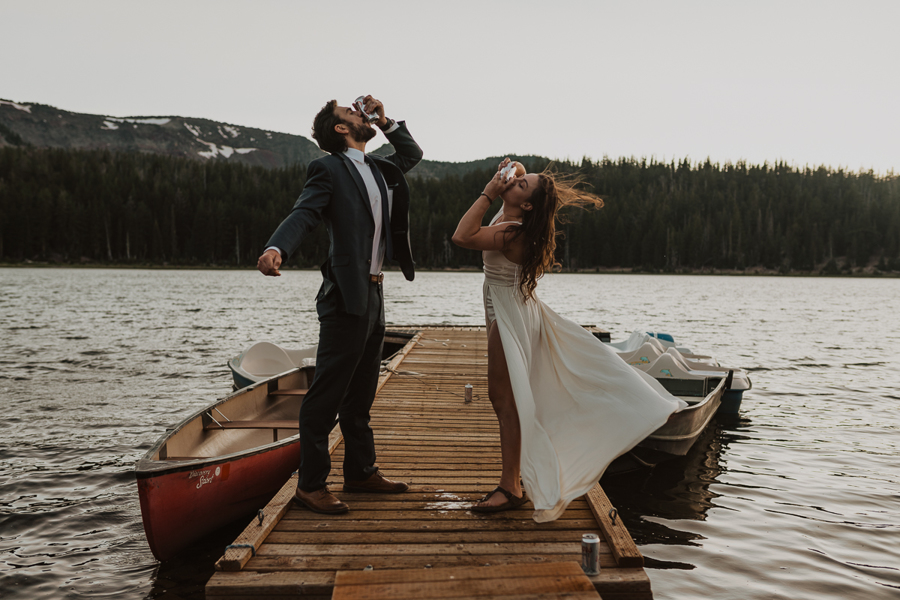 Bride and Groom standing on the dock of Three Creeks Lake during elopement